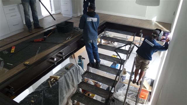 steel studio employees installing balustrades and staircases