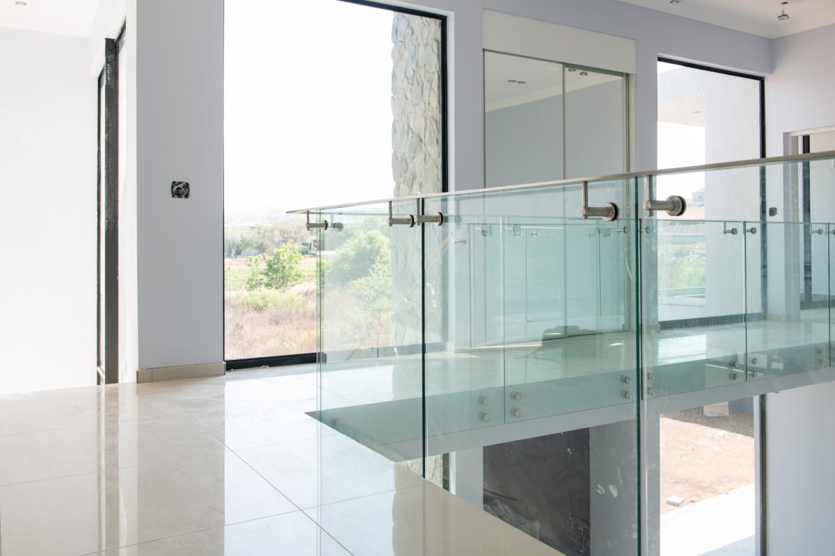 framed glass balustrades with stainless steel handrails in a private residence